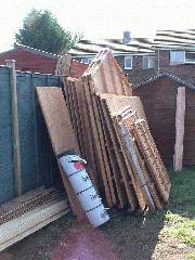 The shed has arrived! (wheelie bin locker leant on the front)