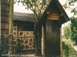 The round log shed - Katie Weston