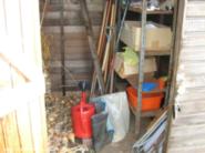 Allotment tools, boots, onions, posts, etc of shed - Allotment Tool Shed, 