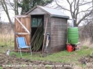Rain collection, storage and dispersal system of shed - Allotment Tool Shed, 