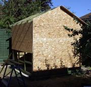 Outer inner cladding goes on of shed - Das Bunker, 
