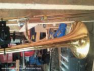 The trombone can hang from the roof for safe keeping of shed - trombone shed, 