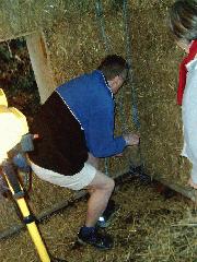 tying the roof on of shed - the straw bale shed, 