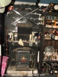 The fire place, electric flame, Scottish Broad sword, dirk & pistol of shed - Tigh Na Ceiteach, South Australia