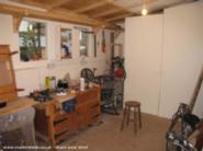 Workbench, got compressor in the corner with a dust extractor under that of shed - Model Gardeners, Greater London
