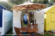 Interior and front view of Stay Put beach hut of shed - Stay Put Beach Hut, Suffolk