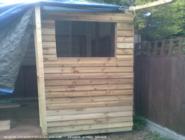 Featherboard complete on right hand window side. of shed - toolboxtan, Greater London