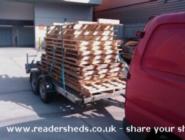 Collecting the pallets from which shed is made of shed - Alan's Shed, Greater London