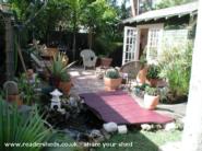Marjorie: Bridge over pond leading to shed