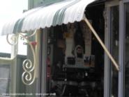 Shed Door Awning, wrought iron brackets of shed - ManBower, 