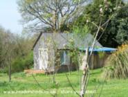 front in spring (cherry tree blossom) of shed - The Knitting Shed, 