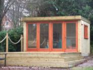 Front view with decking of shed - Cotsmill Garden Office, Hampshire