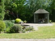 front view from across the garden of shed - My Mombasa inspired Pondhouse, West Midlands