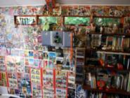 Inside (wall of comics) of shed - The Shack, Nottinghamshire