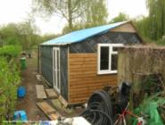First day of many fitting the cladding. of shed - The Shedifice, 