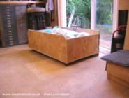 Under bench divan-type drawer rolls out on 8 x 40Kg casters of shed - The Shedifice, 