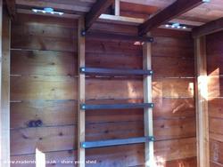 the back wall: lights, ladder & trap door to loft of shed - Lexi's playhouse, California