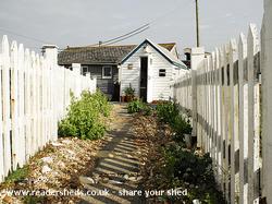 Pathway of desire - perspective pallisade picket style of shed - Dungeness Open Studios - Studio 2, Kent