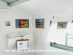 Interior Studio 2 - paintings & prints by the window of shed - Dungeness Open Studios - Studio 2, Kent