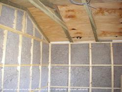 Sheep wool insulation of shed - the SNUG, 