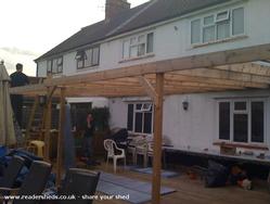 my dad and hubby covering some of the deck area so it can be used all year of shed - peggys place, 
