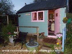 Evening with lights on of shed - Trigger's Broom, 