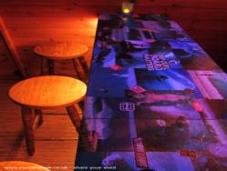 Hand made bar top made from old surf magazines! of shed - Lodge's Tiki Bar, West Yorkshire