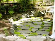 Shed across the creek: patio on the side