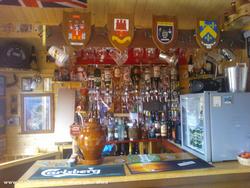 Family crests at bar of shed - El Yanito Bar, Cornwall