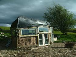 Front view of shed - Boat Roofed Shed, Powys