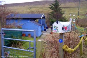Surrounding area and postbox of shed - Da Peerie Hoose, Shetland Islands