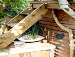 Here I wash the vegetables in a sink under the roof stairs. of shed - Allotment Roof Shed, City of London