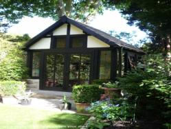 Front View across lawn of shed - The Gothic Retreat, West Midlands