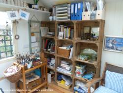 Interior, showing apple crates from Kent used as shelving of shed - The Blue Shed, Durham