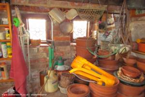 Inside Goring Folly acts as a potting shed of shed - Goring Folly, West Sussex