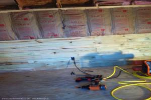 Building up the cedar walls of shed - Jackson's Brew Pub, Oklahoma
