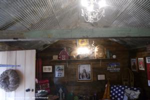 Tin ceiling and chandelier of shed - Teasel's Wood Cabin, Nottinghamshire