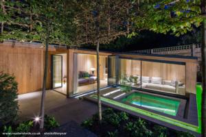 Exterior Evening View of shed - The Garden Room, by Folio Design, Greater London