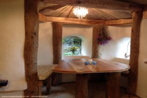 Dining table in alcove of shed - Hobbit House, Gloucestershire