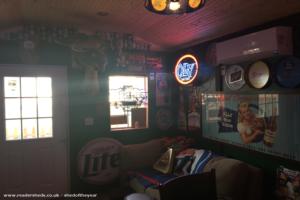 Couch area and HVAC system of shed - The Pub Shed on Prospect, Illinois