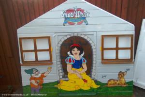 Doc, snow white and forest animals on front panel of shed - The seven dwarfs cottage, Norfolk
