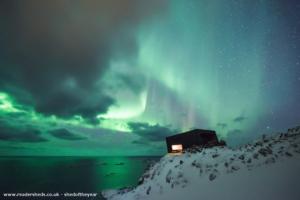 back view, looking north, by polar night of shed - The Kongsfjord cliff shelter, Norway