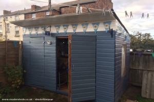 Side and open door of shed - Blue Brothers Bar, Merseyside