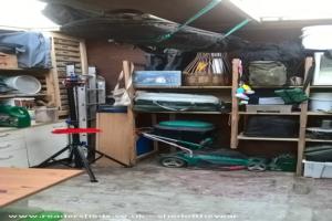 Storage solutions and repair space with fold down table of shed - Chicken View, Northamptonshire