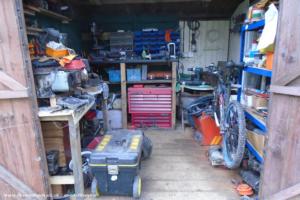 It may only be 8ft square, but you can fit a lot into that space of shed - Matt's Mower Workshop, Dorset