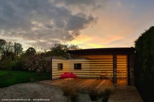 Sunset open view of shed - Scaffold Board Summer House, Hampshire