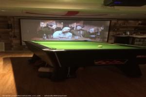 A forward shot of pool table and cinema screen of shed - The Dirty Dick Inn, Worcestershire