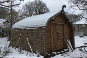 Front view in snow of shed - Viking Bauhutte, Hampshire