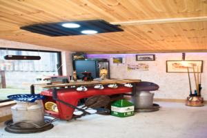 The ceiling lights are a Massey Ferguson 290 tractor grill converted to led. of shed - Man Cave, Lancashire