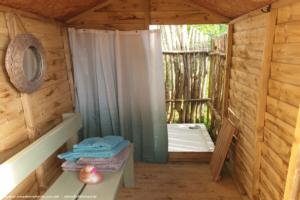Inside view of changing area of shed - Al Fresco Shower Shed, Devon